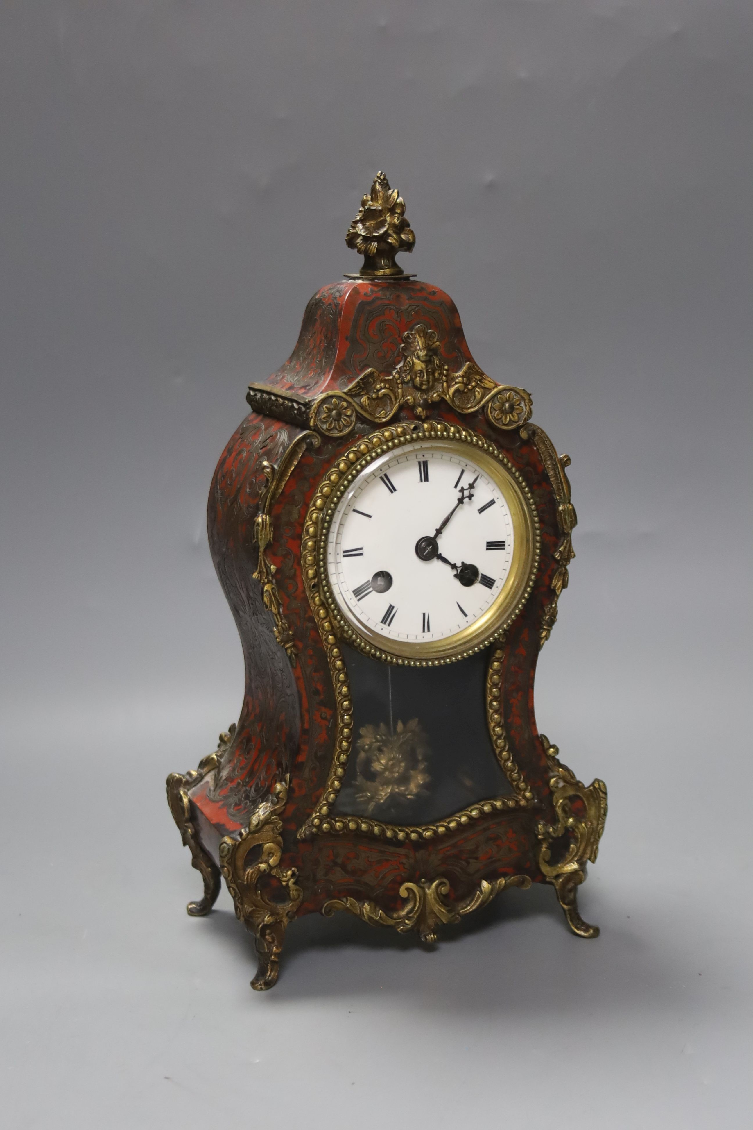 A French scarlet boulle work mantel clock, 29cm high